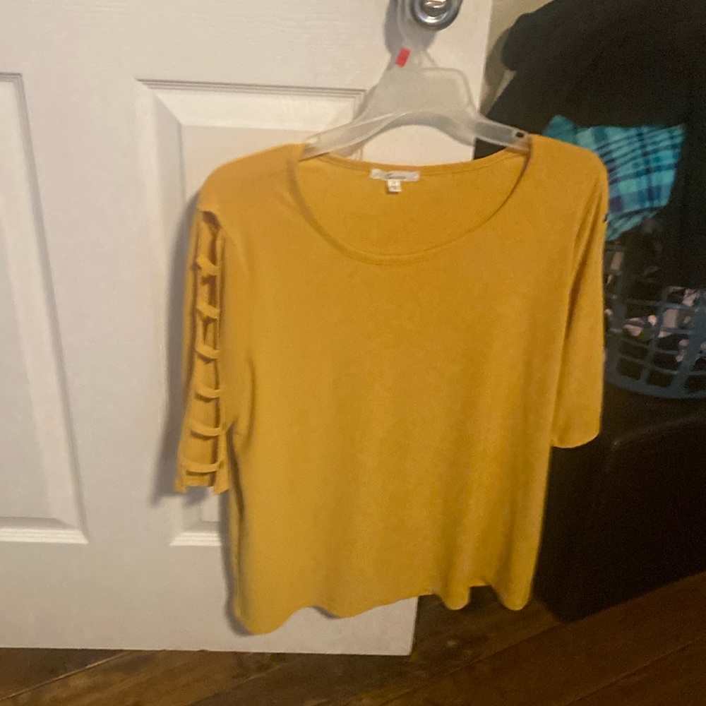 Mustard colored top. Maybe worn one time.